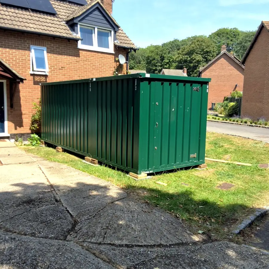 Door To Store unit on a driveway outside a detached house