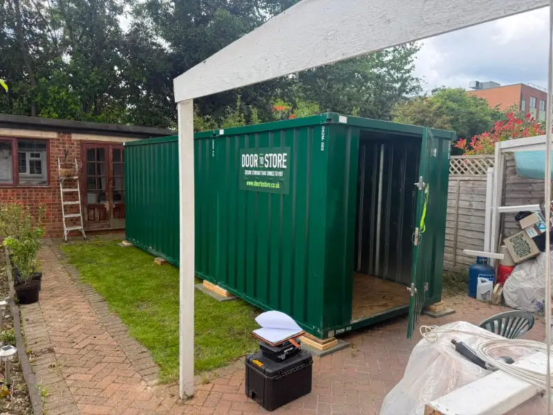 Door To Store unit installed in a back garden beside a house