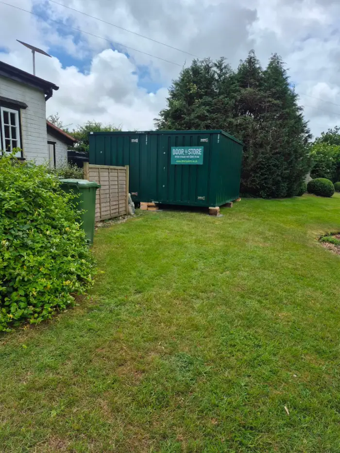 Door To Store unit installed on a lawn beside a house